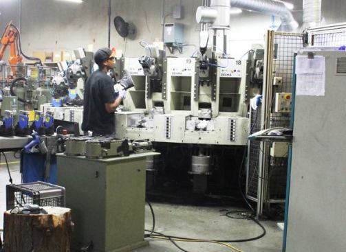 Injection molding the polyurethane midsole is the main operation performed at the plant. This is one of the two Desma machines used to do it. Each machine holds 12 pairs of boots and runs in circular fashion. The German-made machines were purchased used in Europe and refurbished to Keen’s specification.
