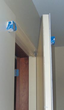 This releases the lever holding the active door open, allowing it to close.