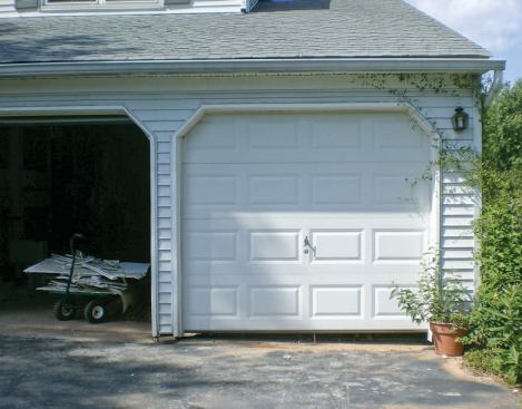 The gap beneath the garage door was a full 8 inches high at the right-hand side.