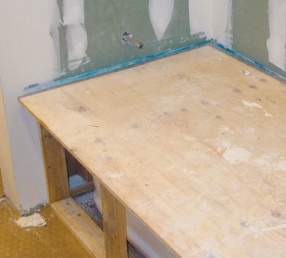 A plywood cover is duct-taped to the Liquid Mask.
