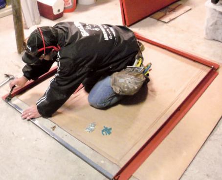 Layout: I typically install Gordon Cellar Doors (gordoncellardoor.com). The first thing I do is spread out the parts in a well-lit area to make sure every piece is accounted for. (If anything's missing, I don't start the job until I have it.) Then I preassemble the steel base so that I have the exact measurements I need for my pressure-treated frame.