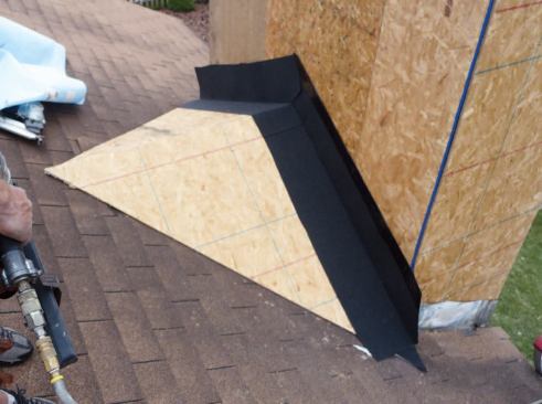 When we do a chase repair, we usually rebuild — or add — a water diverter, or cricket, at the top.