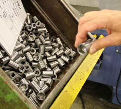 These sockets have been formed to shape and their exteriors lightly machined. If you look closely you’ll see that openings don’t go all the way through. The center will be drilled out in a later operation.
