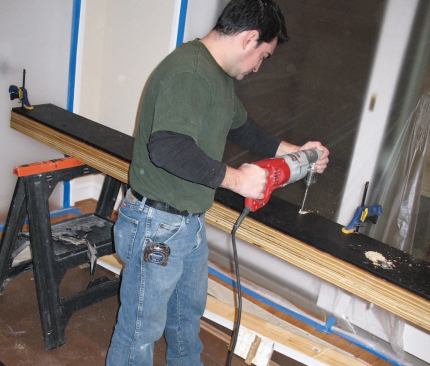 The double-LVL and steel flitch beam was fastened together with 1/2-inch-diameter bolts 16 inches on-center.
