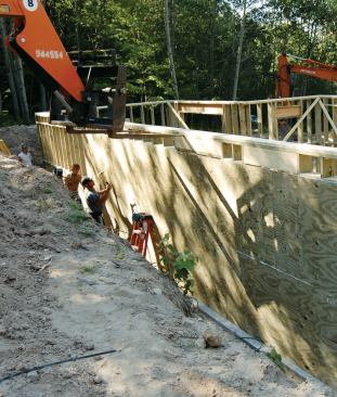Good drainage, reliable waterproofing, and the right structural details yield a warm and dry basement living space.