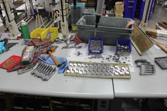 Here’s an assembly station. The thing hanging down the industrial screwdriver used to fasten replaceable wire cutters into the plier heads.