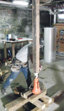 The posts are jacked just enough to make them tight and to loosen the existing columns.