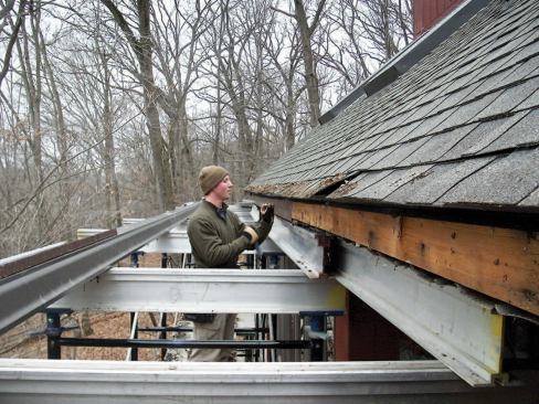 Shoring jacks at the base and adjustment screws at each cradle allowed the roof to be raised carefully and remain level.