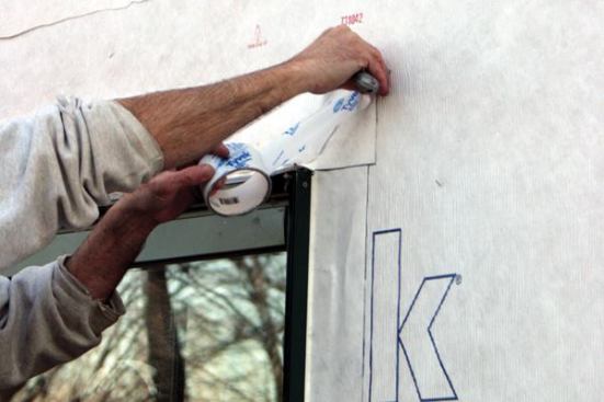 ...then tape the 45-degree corners with housewrap tape.