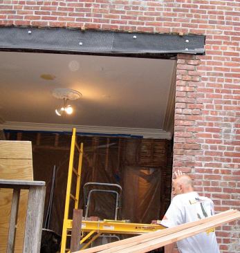 The mortar joints are intentionally left deep so that they can later be filled by the finishing mason with a color-matched mortar.