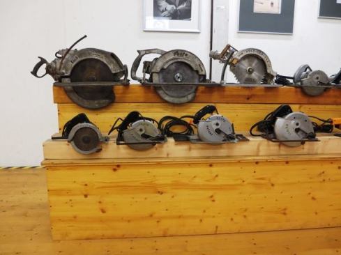 Here’s another look at the circular saws. Festool invented the plunge cutting track saw in 1964 though saws that ran on or were adapted to tracks go a lot farther back. Look closely and you’ll see that the third saw from the left on the lower level (an early 1950s model) is attached to a short section of track.