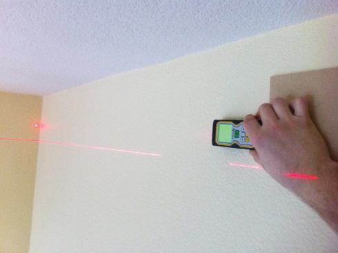 Using a Stabila LD 400 digital laser measure.