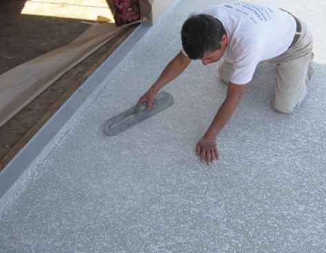 The texture is troweled flat shortly after application to leave a knockdown finish.
