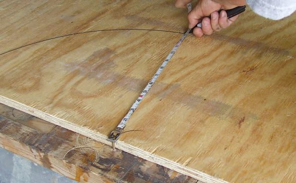 With the steep pitch, the full semicircle looked right, so I cut a pattern out of 3/4-inch plywood.