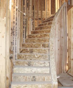The curved wall was topped with two layers of 1/4-inch OSB. I finished up with the sander, striving for a good visual flow.