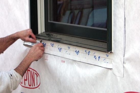 Skip-Tape the Sill Flange
I also skip-tape the bottom (uncaulked) sill flange so that any moisture that gets in can weep out. Skip-taping also limits air leaks, though it's not entirely airtight.