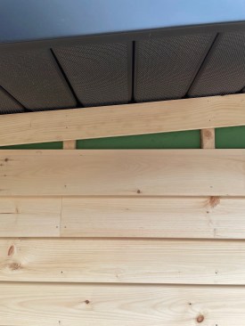 At the top of the end walls, clapboards had to be ripped at a steep angle with a track saw to butt against the frieze board.