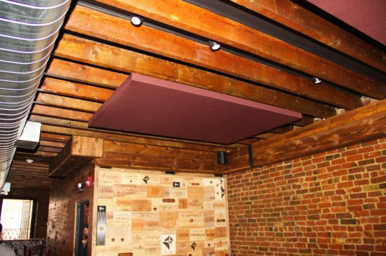 Panels for the ceiling of the restaurant were not screen printed, but instead were wrapped in a complementary, but unobtrusive color to blend into the background. A relatively small area of ceiling and wall panels is sufficient to dramatically reduce noise levels in a public space.