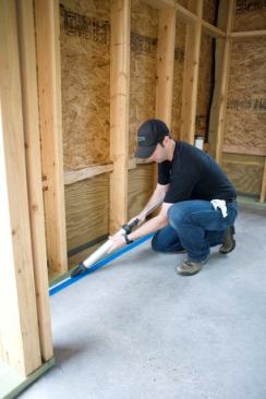 We used Tremco Dymonic caulk at the slab-to-bottom-plate connections, for additional air-sealing.