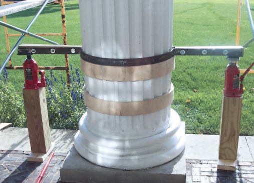 The original plan was to replace only the column bases. Accordingly, the crew installed structural steel clamp rings around the shafts and shifted the weight from the pedestals to the concrete porch using 20-ton hydraulic jacks.