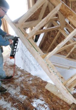 Subfascia: After filling in the rest of the rafters, we ran 2x4 ceiling joists across the plates, extending them a few inches to catch a 2x6 subfascia.