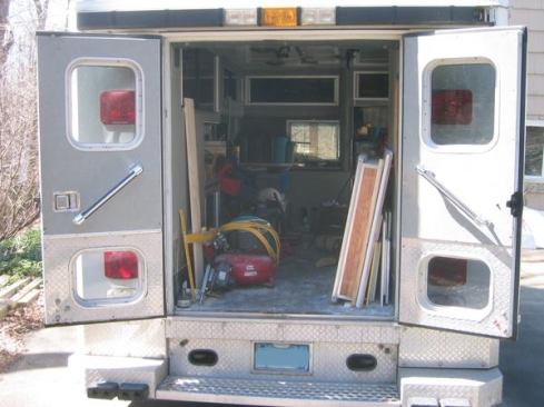 With the rear doors open it's easy to tell this is a contractor's truck. The bumper is low so it's a short step up to the floor, and the ceiling is 6' high. Note the window at the front of the module; it can be opened to allow long material to extend into the cab. This allows the author to haul 18' trim with the back doors closed.
