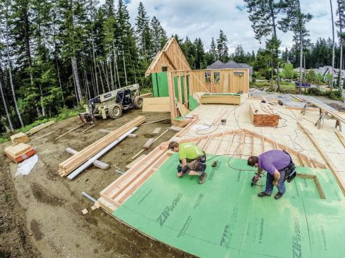 Once the frame is complete, we sheathe and tape the wall (or install housewrap, if we aren't using Zip Wall), so we are ready to apply an overhang.