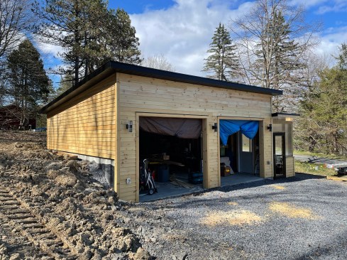 The installed clapboards will be left to weather to gray without any applied finish.