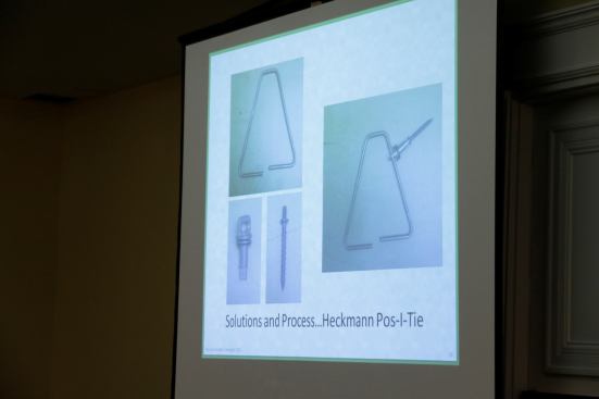 Heckmann Pos-I-Tie Masonry anchors that screw through the foam into the 3/4? sheathing (not necessary to hit studs).