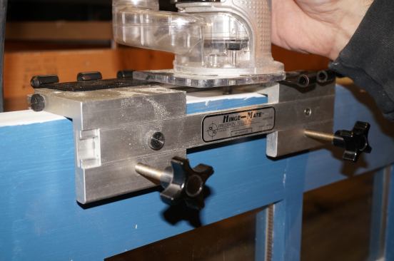 To save time and effort Greg uses a router and a Hinge Mate jig for the hinge mortises. He sets the bit to the correct depth by placing two hinge leaves on the jig and extending the bit down to either the door or the jamb.