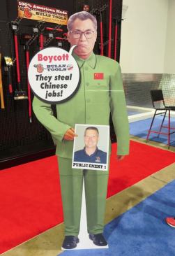 Cardboard Man. This cardboard cut-out was at the booth for Bully Tools, a brand of long handled shovels, digging bars, and garden tools made in Steubenville, Ohio. The owner, whose picture Cardboard Man is holding, was making the point that his company’s tools are 100% U.S. made. I’m not quite sure whose face that is on Cardboard Man; he reminds me of a villain I once saw in a Bruce Lee (or was it James Bond?) movie.