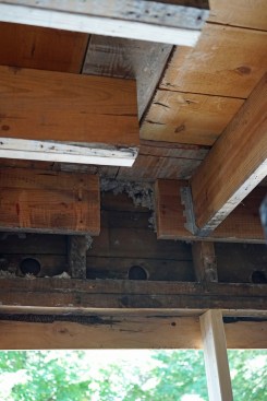 Flush beam. After removing the old beam, they cut through the ledger so the new flush beam will extend over the window, and a new header will be installed beneath it, supported by full length jack posts that extend to the foundation wall to complete the load path.