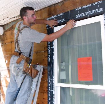 The frames were taped to the sheathing with self-adhering flashing tape.