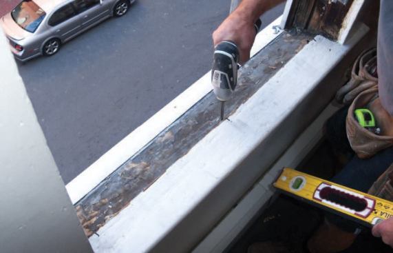 Next I provide a level bearing across the sill by using screws as shims.