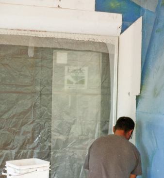 Once the WeatherSeal membrane has been installed, DrainEdge termination strips are stapled over door and window openings, followed by backwrapping mesh.