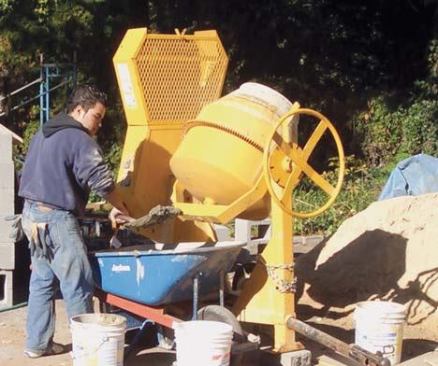 An electric side-loading concrete mixer.