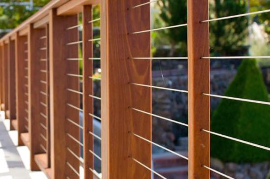 Cables for typical residential installation will have nine to 11 cables, while commercial-grade railing will have 12 to 13 cables because of the higher 42 inch top rail requirement. Cables on long runs can pass through the centers of intermediate posts.