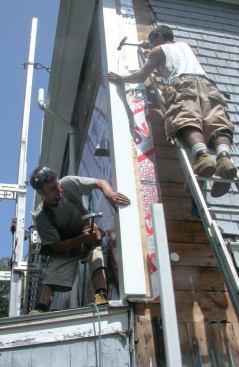 Workers trimmed the corners with one-piece Azek PVC corner boards.