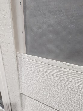 The cladding system includes corner trim with a nailing fin to enable hidden fastening and a built-in channel that locks in the siding boards.