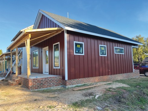 Hardie fiber-cement trim and siding and front porches accent the homes. 
