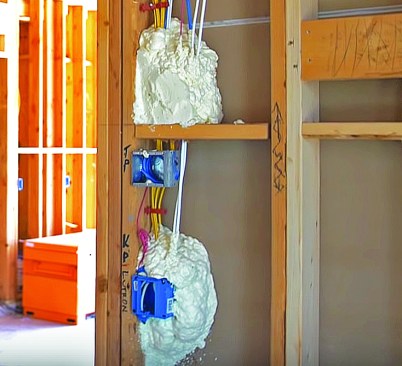This allows him to begin air-sealing penetrations, such as packing electrical boxes with a two-part, closed-cell spray foam.