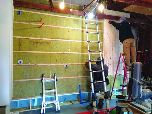 Walls shared with the garage received one thermal break with horizontal strapping and one layer of Rockwool Comfortboard 80.