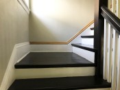 On this stair landing, the baseboards and skirtboards, as well as the profiled cap moldings, are joined with bisected angles.