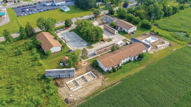 To streamline permitting, Joel Florek chose lots at the edges of an existing apartment complex.