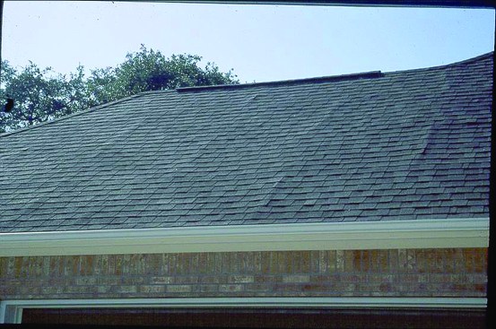 Wet sheathing may swell at the edges. When the sheathing dries, the edges may still not return to their original size and ridges telegraph through roofing. Photo: Steve Easley