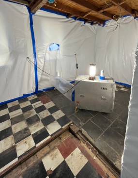 The discovery of the old tile prompted a test for asbestos, which proved positive, requiring a pause in the renovation to remediate the asbestos.
