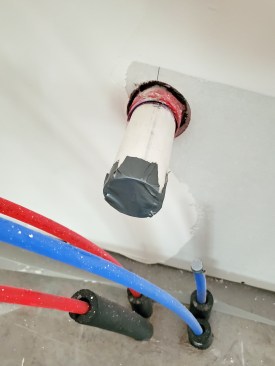 Plumbing drains should be sealed; if the trap is present, filling the trap with water will stop air moving through the waste and drain system. Duct tape can create an effective temporary air seal.