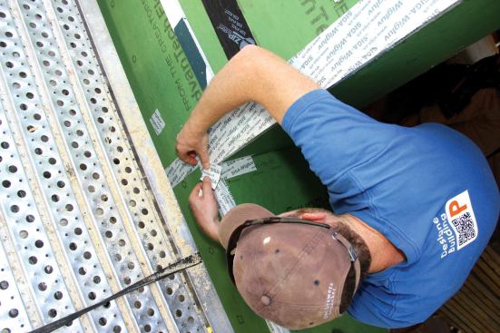 Finally, a small patch of tape is applied over the complicated corner intersections of the sill with the jambs and the wall sheathing (7). Everything inboard of the window plane, including the inner part of the window bucks, is left untaped so that the wall can dry to the inside.