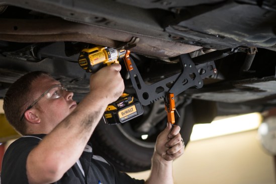 Shown here in an automotive use, it illustrates how the Rapidrill can access tight spots and work on variously shaped materials.