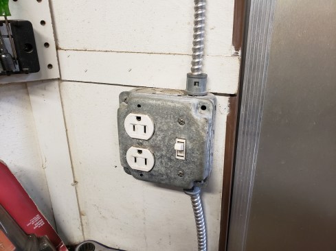 The fluorescent lights are switched by the side entry door. 